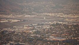 5K aerial stock footage of Bob Hope International Airport in Burbank, California, sunset Aerial Stock Footage | AX64_0131E