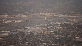 5K aerial stock footage flyby Bob Hope International Airport, Burbank, California, sunset Aerial Stock Footage | AX64_0132