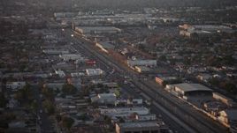 5K aerial stock footage of San Fernando Road and warehouse buildings in Pacoima, California, Sunset Aerial Stock Footage | AX64_0140