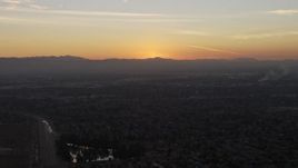 5K aerial stock footage of suburban neighborhoods and distant mountains, Pacoima, California, sunset Aerial Stock Footage | AX64_0145