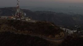 5K aerial stock footage of radio tower above Hollywood Sign, Los Angeles, California, twilight Aerial Stock Footage | AX64_0164E