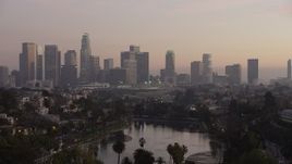 5K aerial stock footage fly over Echo Lake to approach Downtown Los Angeles at twilight, California Aerial Stock Footage | AX64_0183