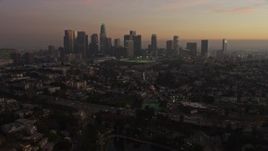 5K aerial stock footage fly over Echo Lake and Highway 101 to approach Downtown Los Angeles skyline, California, twilight Aerial Stock Footage | AX64_0184E