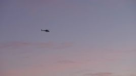 5K aerial stock footage of a police helicopter in the sky, Los Angeles, California, twilight Aerial Stock Footage | AX64_0203