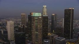 5K aerial stock footage flyby Figueroa at Wilshire skyscraper in Downtown Los Angeles, California, twilight Aerial Stock Footage | AX64_0207