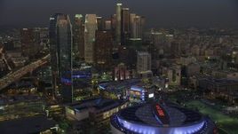 5K aerial stock footage of passing Staples Center, Nokia Theater, Ritz-Carlton and skyscrapers, Downtown Los Angeles, California, twilight Aerial Stock Footage | AX64_0225