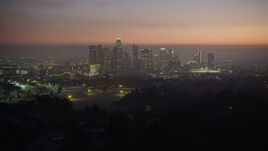 5K aerial stock footage fly over hill to reveal the Downtown Los Angeles skyline, California, twilight Aerial Stock Footage | AX64_0258