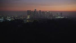 5K aerial stock footage fly over hill to reveal the Downtown Los Angeles skyline, California, twilight Aerial Stock Footage | AX64_0258E
