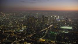 5K aerial stock footage of tall skyscrapers and Highway 110 in Downtown Los Angeles, California at twilight Aerial Stock Footage | AX64_0263