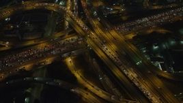 5K aerial stock footage of I-10 and 110 freeway interchange with heavy traffic, Downtown Los Angeles, California, night Aerial Stock Footage | AX64_0273E