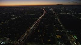 5K aerial stock footage of heavy traffic on Interstate 10 through Pico-Union, Los Angeles, California, twilight Aerial Stock Footage | AX64_0275