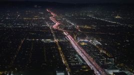 5K aerial stock footage of heavy traffic on I-405 freeway through Sawtelle, Los Angeles, California, night Aerial Stock Footage | AX64_0290E