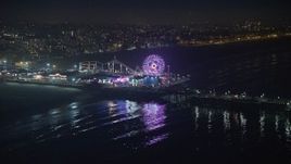 5K aerial stock footage approach the Pacific Wheel at Santa Monica Pier, Los Angeles, California, night Aerial Stock Footage | AX64_0306E