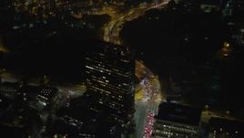 5K aerial stock footage fly over Wilshire Boulevard and a tall office building at night, Sawtelle, Los Angeles, California Aerial Stock Footage | AX64_0317