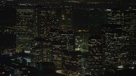 5K aerial stock footage of reverse view of Century City Skyscrapers, Los Angeles, California, night Aerial Stock Footage | AX64_0324