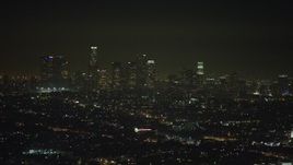 5K aerial stock footage of passing the Downtown Los Angeles skyline at night, California Aerial Stock Footage | AX64_0341E