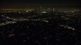 5K aerial stock footage of Downtown Los Angeles skyline and city sprawl seen from Echo Park, California, night Aerial Stock Footage | AX64_0347