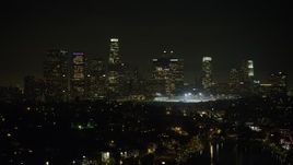 5K aerial stock footage of Downtown Los Angeles skyline at night seen from Echo Lake, California Aerial Stock Footage | AX64_0351