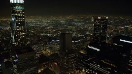 5K aerial stock footage fly between skyscrapers in Downtown Los Angeles, California, night Aerial Stock Footage | AX64_0358