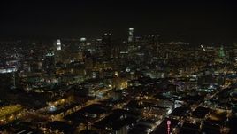 5K aerial stock footage reverse view of office buildings and Downtown Los Angeles skyscrapers, California, night Aerial Stock Footage | AX64_0360