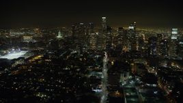 5K aerial stock footage follow 6th Street to approach Downtown Los Angeles, California, night Aerial Stock Footage | AX64_0380