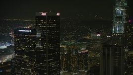 5K aerial stock footage approach Aon Center and tilt to Westin Bonaventure Hotel, Downtown Los Angeles, California, night Aerial Stock Footage | AX64_0391E