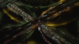 5K aerial stock footage bird's eye view of Highway 110 and Highway 101 interchange, Downtown Los Angeles, California, night Aerial Stock Footage | AX64_0399E
