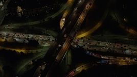 5K aerial stock footage of the 110 and 101 freeway interchange in Downtown Los Angeles, California, night Aerial Stock Footage | AX64_0401