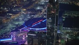 5K aerial stock footage of passing Ritz-Carlton Hotel to focus on Staples Center, Downtown Los Angeles, California, night Aerial Stock Footage | AX64_0406