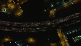 5K aerial stock footage tilt to bird's eye view of heavy traffic on Interstate 5, Burbank, California night Aerial Stock Footage | AX64_0427E