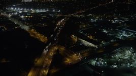 5K aerial stock footage of Interstate 5, warehouses, and suburban neighborhoods, Sun Valley, California, night Aerial Stock Footage | AX64_0440