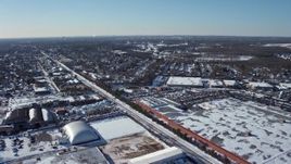 4.8K aerial stock footage of snow covered industrial area in Farmingdale, New York Aerial Stock Footage | AX66_0001