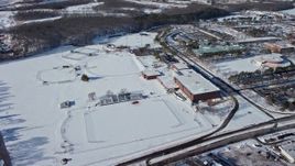 4.8K aerial stock footage of a snow covered sports field at the State University of New York at Farmingdale, Long Island Aerial Stock Footage | AX66_0002E