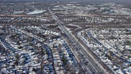 4.8K aerial stock footage of freeway interchanges and neighborhoods in snow, Plainview, New York Aerial Stock Footage | AX66_0011E