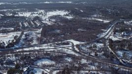 4.8K aerial stock footage of flying towards forests in snow, Jericho, New York Aerial Stock Footage | AX66_0016