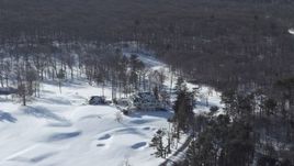 4.8K aerial stock footage of a snow covered mansion, Jericho, New York Aerial Stock Footage | AX66_0017