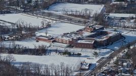 4.8K aerial stock footage of orbiting a school in snow, Great Neck, New York Aerial Stock Footage | AX66_0035