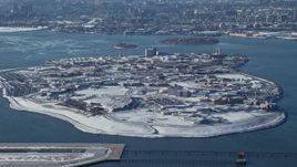 4.8K aerial stock footage of the penitentiary on Rikers Island in snow New York Aerial Stock Footage | AX66_0045E