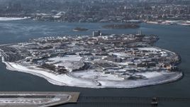 4.8K aerial stock footage of the penitentiary on Rikers Island in snow New York Aerial Stock Footage | AX66_0046
