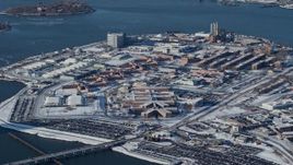 4.8K aerial stock footage of prison buildings on Rikers Island in snow, New York Aerial Stock Footage | AX66_0049
