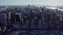 4.8K aerial stock footage tilt from Central Park to reveal Midtown Manhattan in winter, New York City Aerial Stock Footage | AX66_0107E