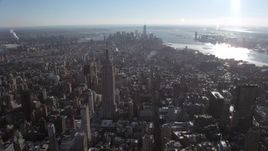 4.8K aerial stock footage approach Empire State Building with view of Lower Manhattan, New York City Aerial Stock Footage | AX66_0112