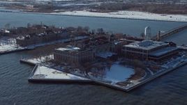 4.8K aerial stock footage of Ellis Island buildings with snow, New York Aerial Stock Footage | AX66_0125E