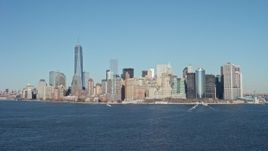 4.8K aerial stock footage tilt from New York Harbor to reveal skyline in Lower Manhattan, New York City Aerial Stock Footage | AX66_0133E