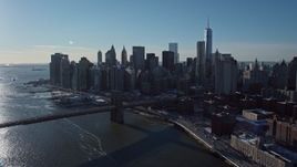 4.8K aerial stock footage approach Lower Manhattan skyline and Brooklyn Bridge, New York City Aerial Stock Footage | AX66_0148E