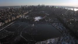 4.8K aerial stock footage fly over Central Park and approach Midtown Manhattan in snow, New York City Aerial Stock Footage | AX66_0200