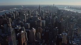 4.8K aerial stock footage of Midtown, with Lower Manhattan in background in winter, New York City Aerial Stock Footage | AX66_0212