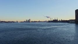 4.8K aerial stock footage of the Williamsburg Bridge on East River in winter, New York City, Sunset Aerial Stock Footage | AX66_0225