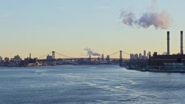 4.8K aerial stock footage approach the Williamsburg Bridge on East River, New York City sunset Aerial Stock Footage | AX66_0226E