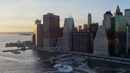 4.8K aerial stock footage of riverfront skyscrapers in Lower Manhattan, New York City, at sunset Aerial Stock Footage | AX66_0236
